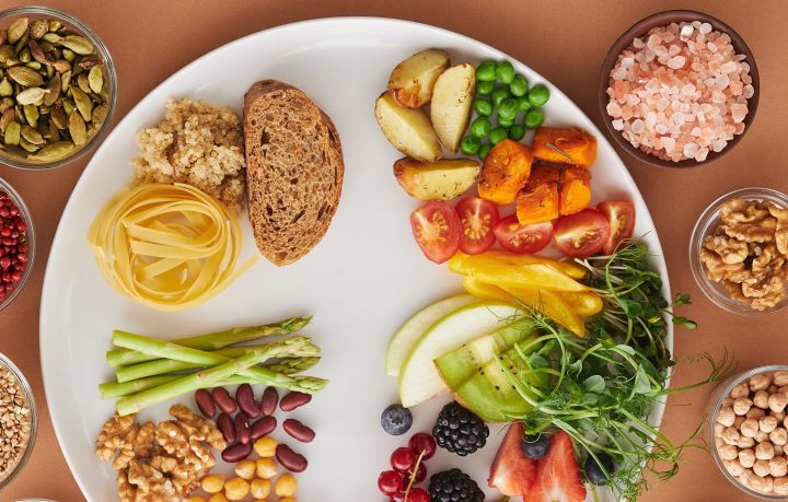 A plate of fruits, vegetables and whole grains
