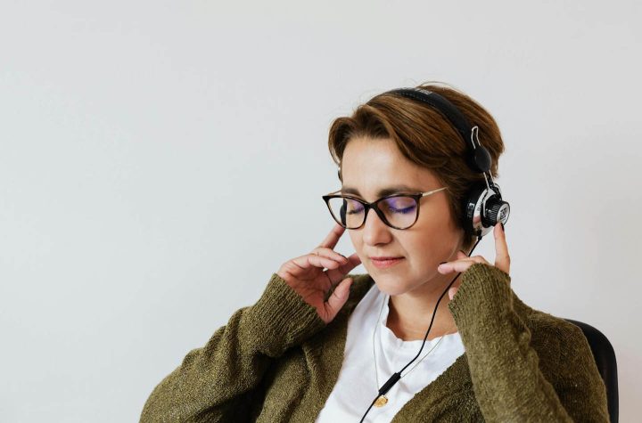 A woman with headphones listening to relaxing music