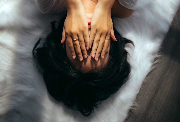 A woman being overwhelmed by stress