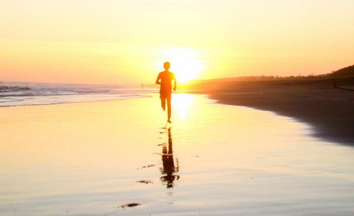 A man running on a beach