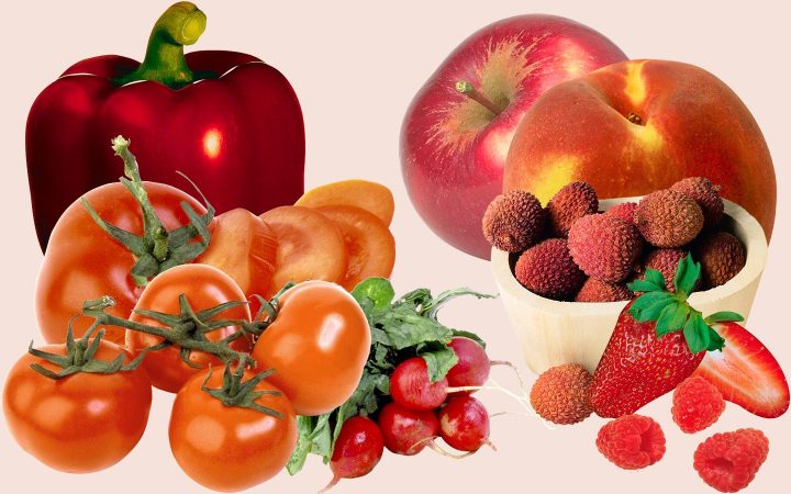 Assortment of red fruits and vegetables including tomatoes, radishes, strawberries, litchis, apple, pear and bell pepper.