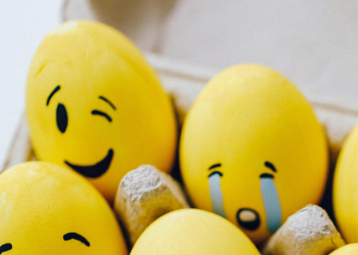 Painted eggs with a happy and sad face