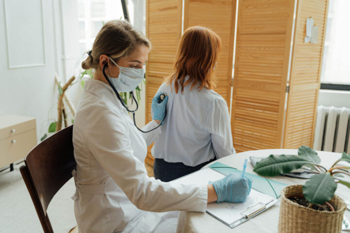 Doctor examining the lung of a patient