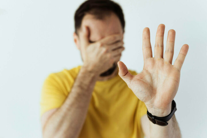 A man in posture of denial