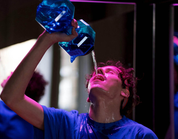 A man drinking water after a strenuous workout