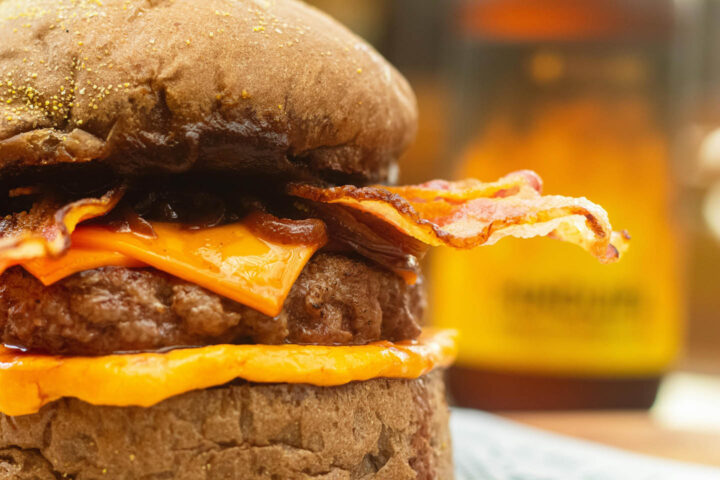 A fat dripping cheeseburger