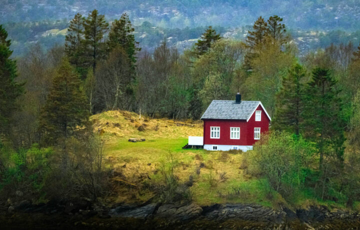 A typical wooden Norwegian house in a tranquil nature setting