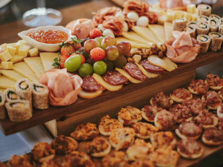 A charcuterie board on a festive buffet
