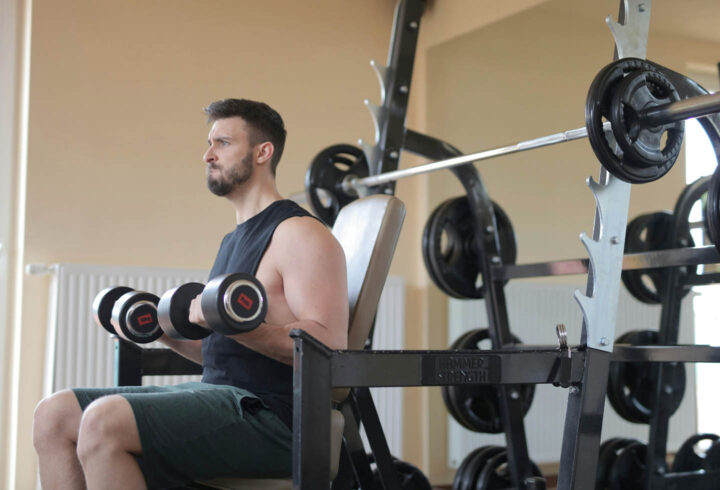 A man lifting weights in a gym