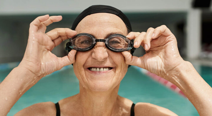 A senior swimming in a pool
