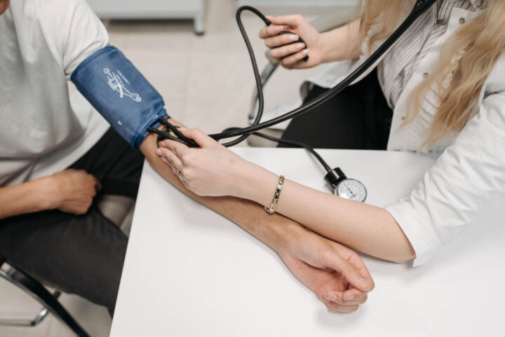 A nurse measuring blood pressure